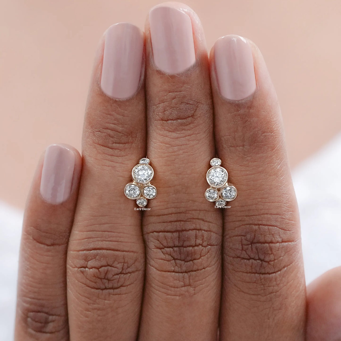 round bezel set diamond hoops front view on fingers
