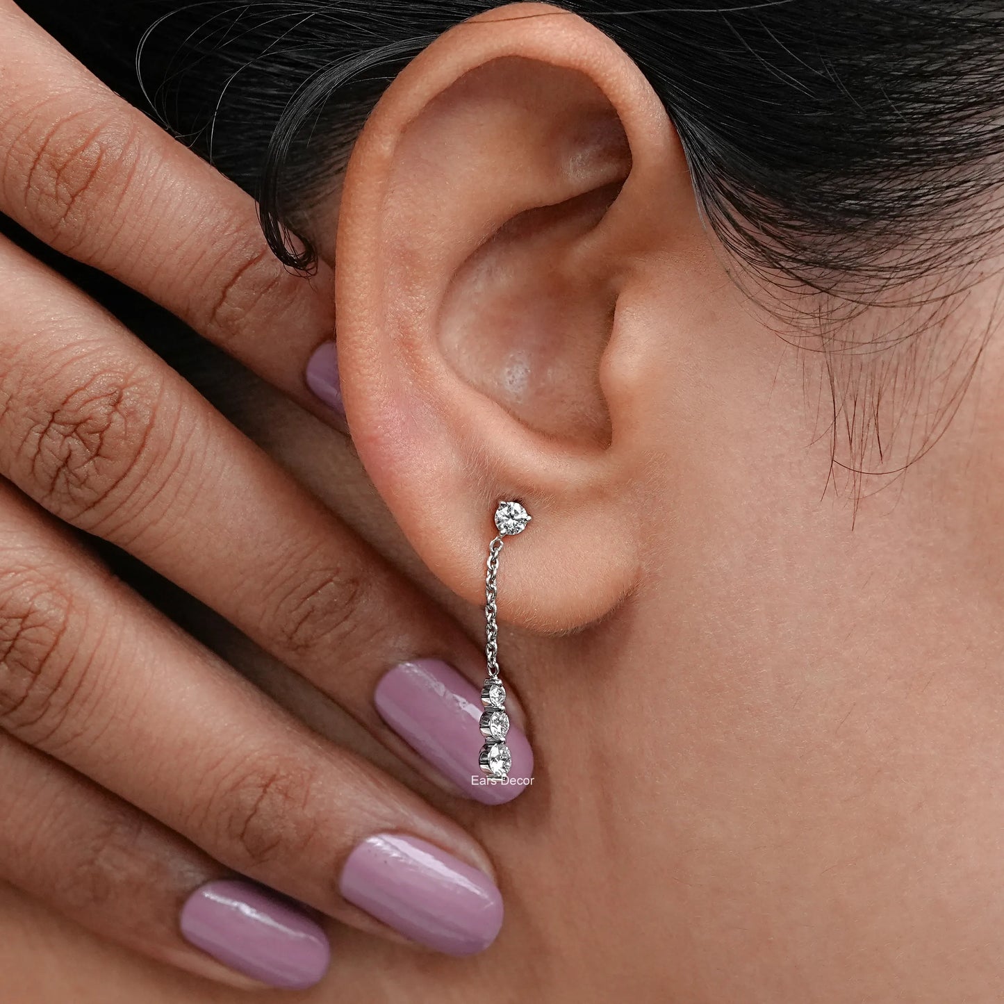 round diamond cable chain earrings on ear with modern minimal look