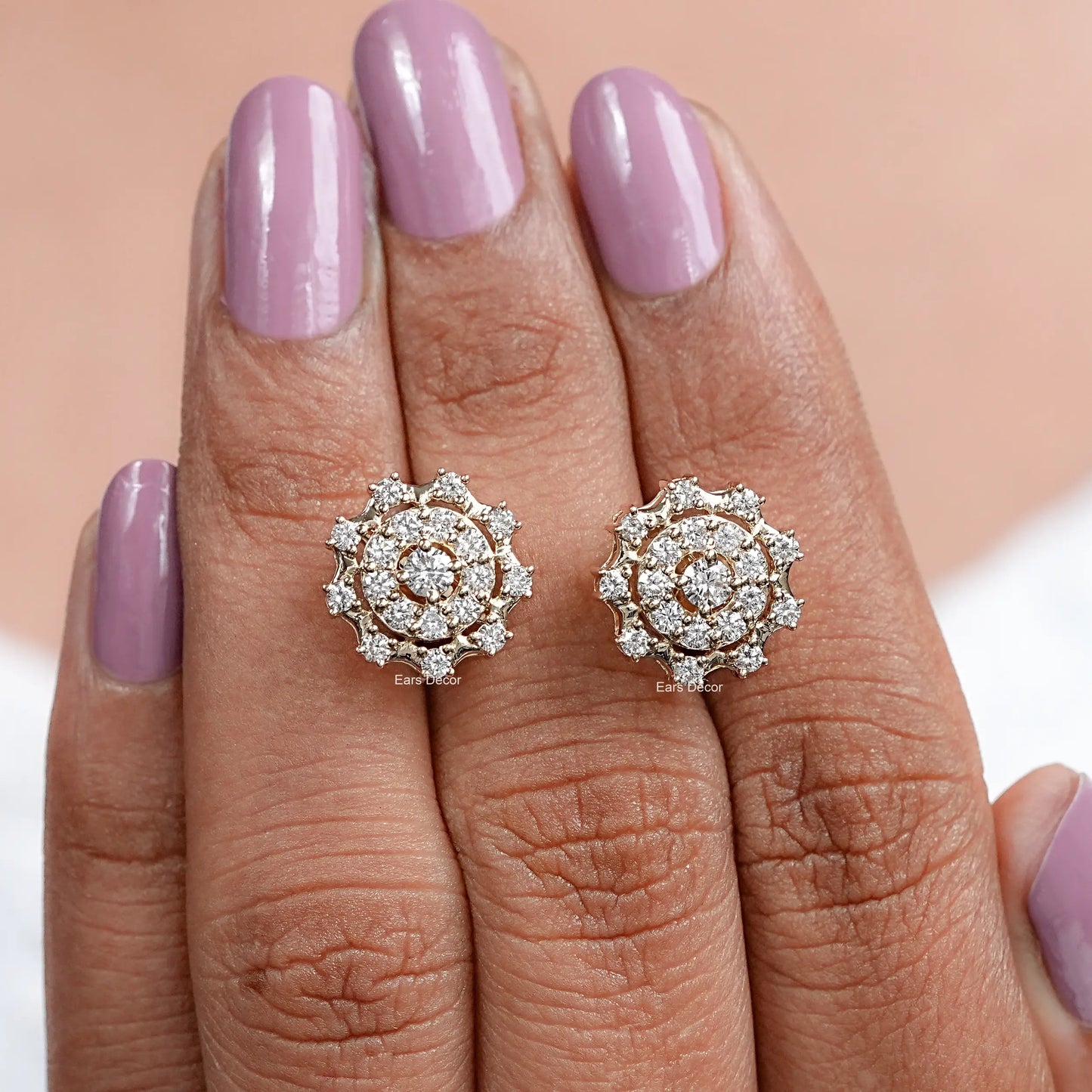 brilliant round cut double halo diamond earrings displayed on fingers for size view