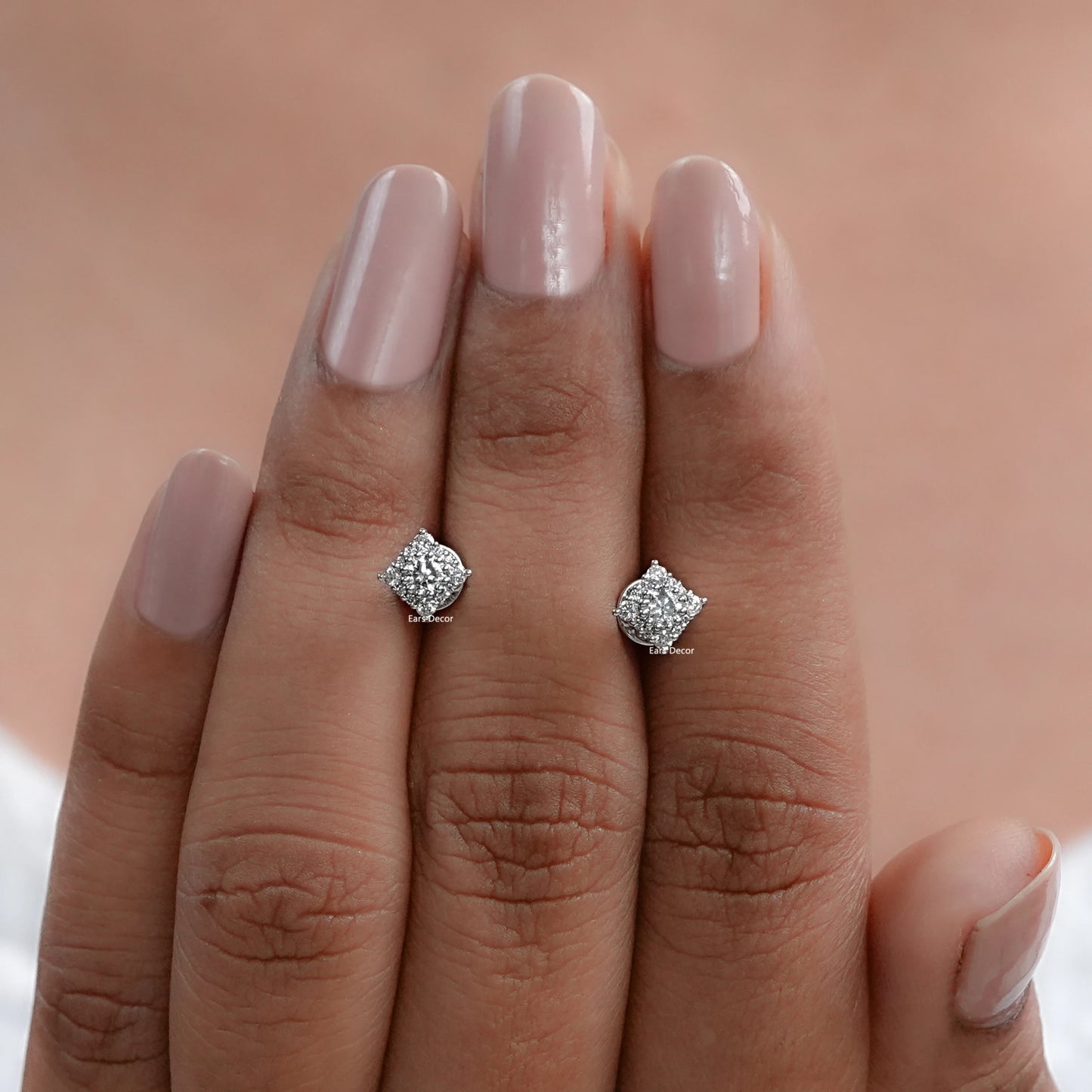 18K White gold lab diamond halo square cluster stud earrings on hand with nude blush pink nails
