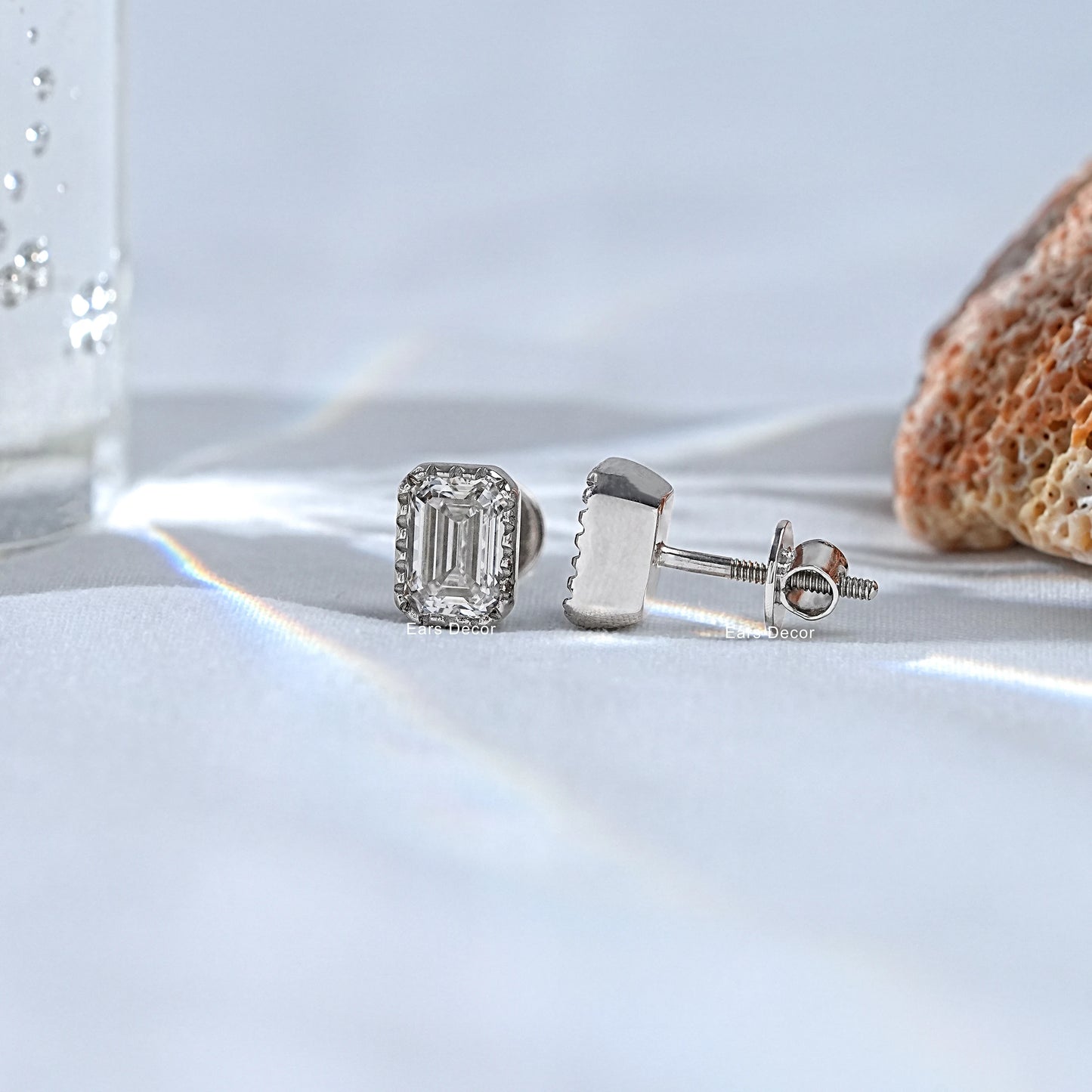 fg colour emerald cut natural diamond earrings on ear