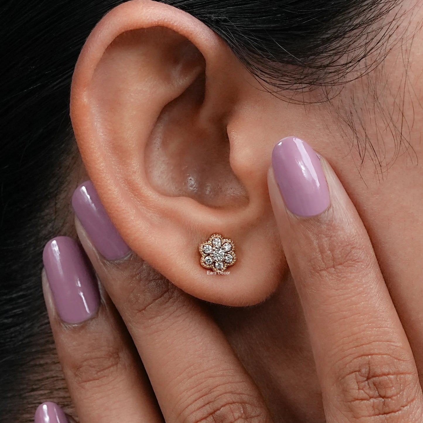 close up of round diamond cluster stud on ear