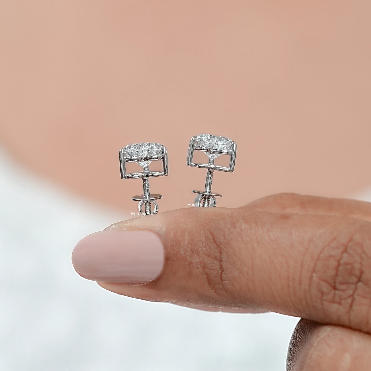 side view of heart cut moissanite solitaire stud earrings in white gold prong setting