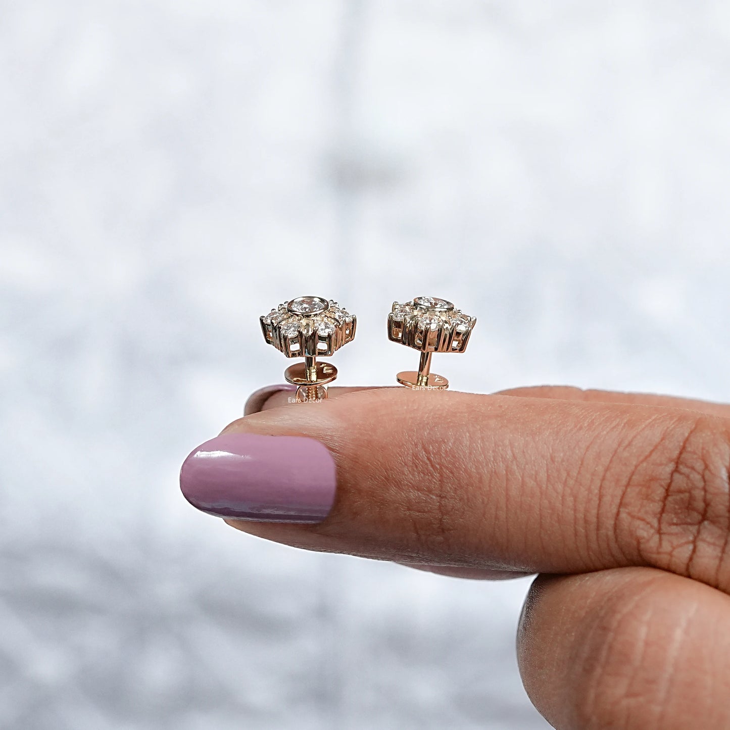 side view of solid gold minimalist diamond stud earrings