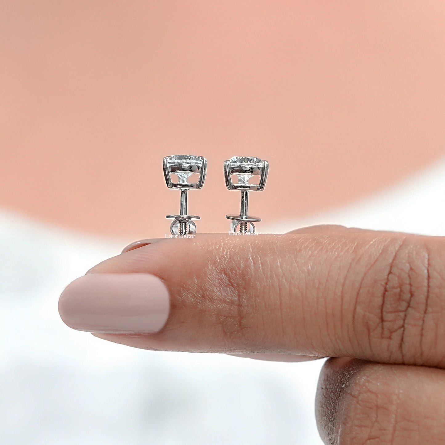 side view of pear lab grown diamond gold earrings with screw back settings