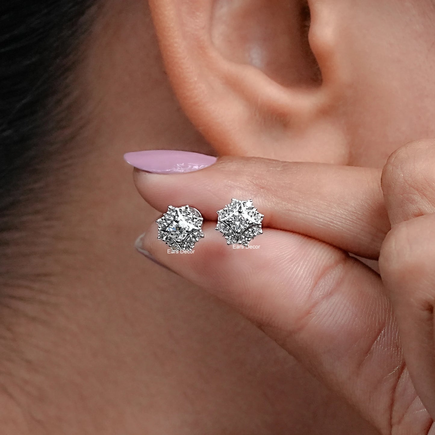 natural round cluster stud earrings close up on fingers
