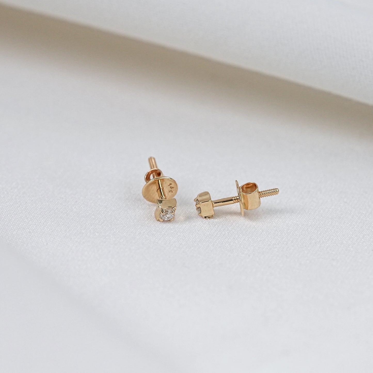 classic solitaire diamond earrings with screw back