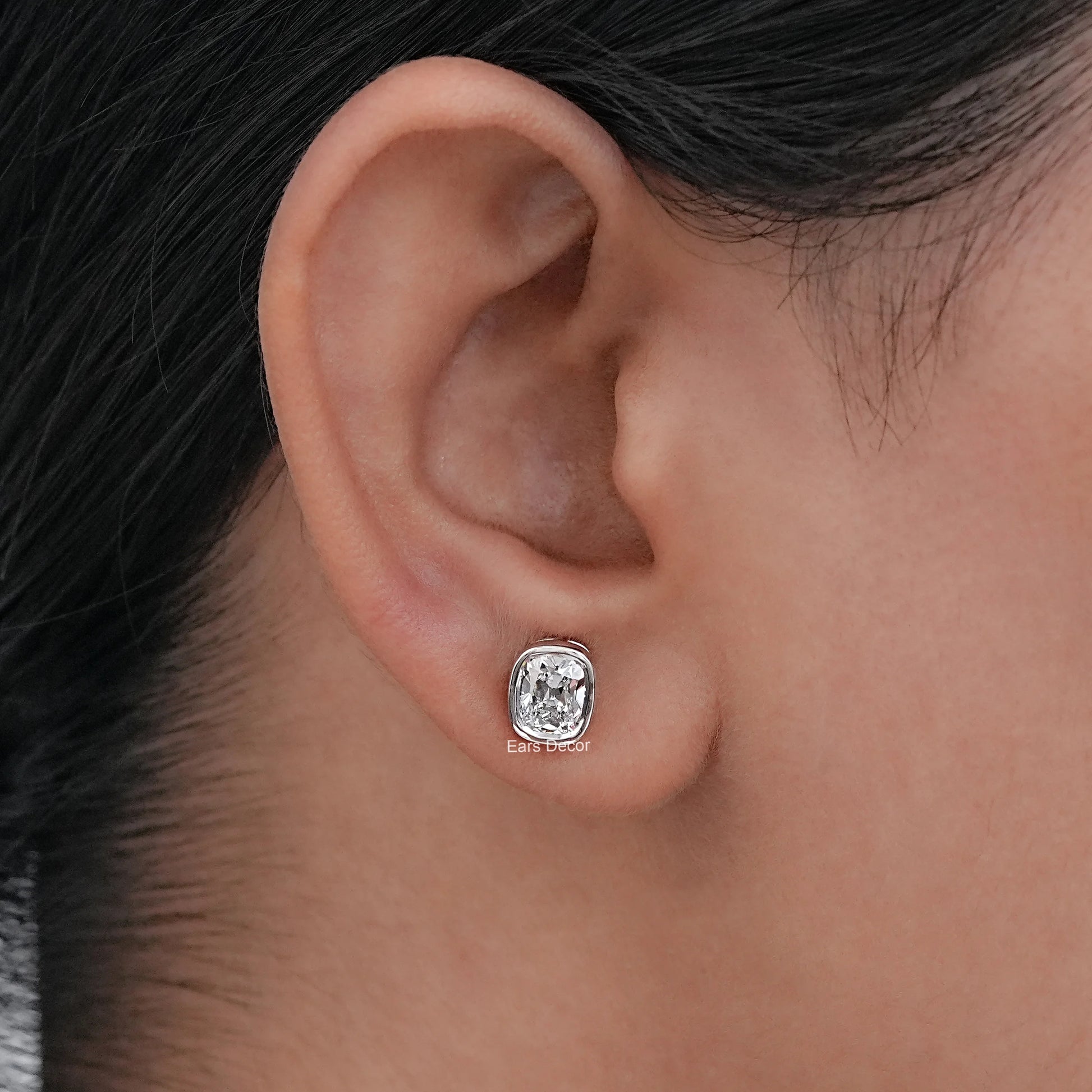 Old Mine Cushion Cut CVD Diamond Stud Earrings in 925 Silver, showcased on a model's ear.