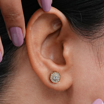 model showcasing a brilliant cut round diamond halo earring in octagon shape