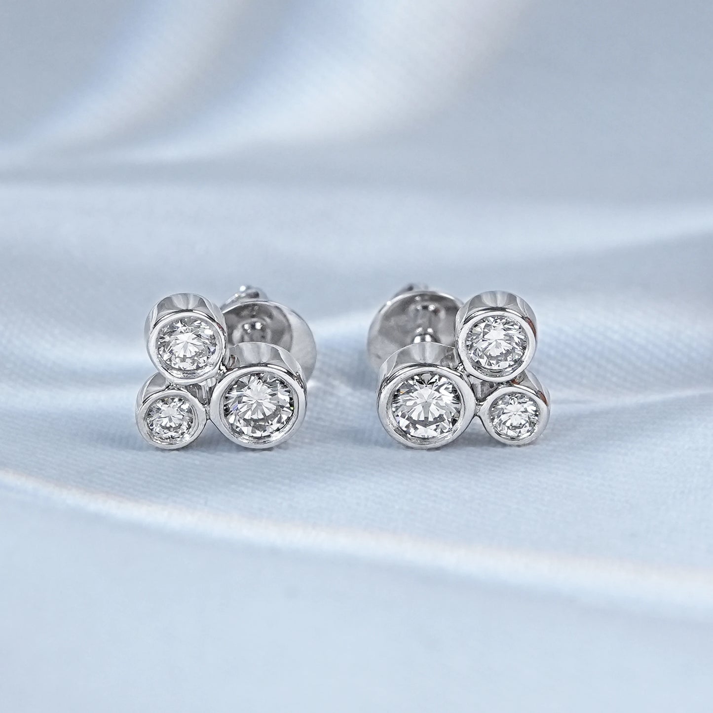 Three Stone Round Diamond Bezel Set Stud