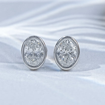 Earth Mined Oval Cut Diamond Bezel Set Stud Earrings