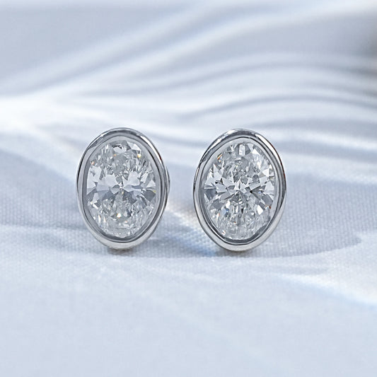 Earth Mined Oval Cut Diamond Bezel Set Stud Earrings