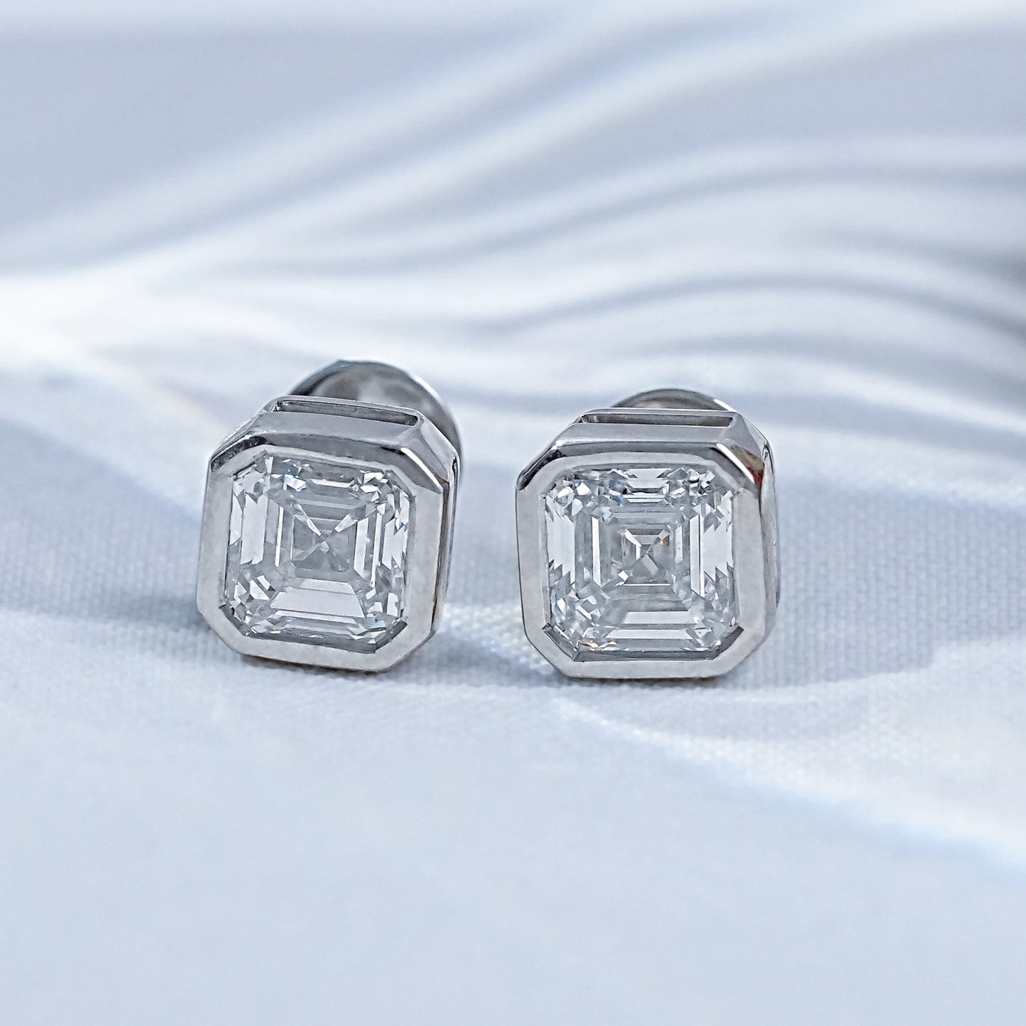 Colorless Asscher Cut Solitaire Bezel Set Stud Earrings
