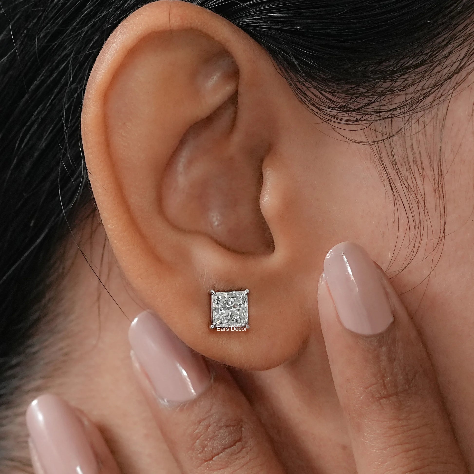princess cut lab diamond solitaire studs shown against dark velvet, demonstrating a fetching and clean silhouette that is absolutely spot on for a timeless look.