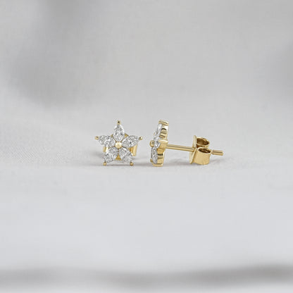 Marquise diamond flower stud earrings featuring five brilliant petals around a central gold bead.