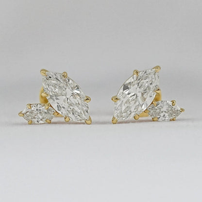 Marquise cut Toi et Moi diamond stud earrings in 14k yellow gold for women brilliant cut diamonds prong setting detail