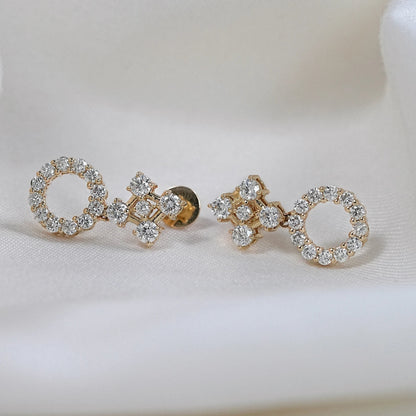Yellow gold round lab diamond circle hoop and square cluster stud earrings with screw backs on white silk fabric