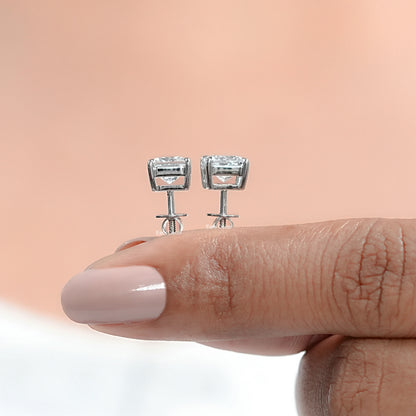 princess cut diamond solitaire studs revealing the superb clarity of the ethical diamonds and the sturdy, premium quality of the four prong mount.