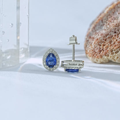 Classic blue sapphire teardrop stud earrings pave diamond surround front and back view showing white gold butterfly clasp post detail