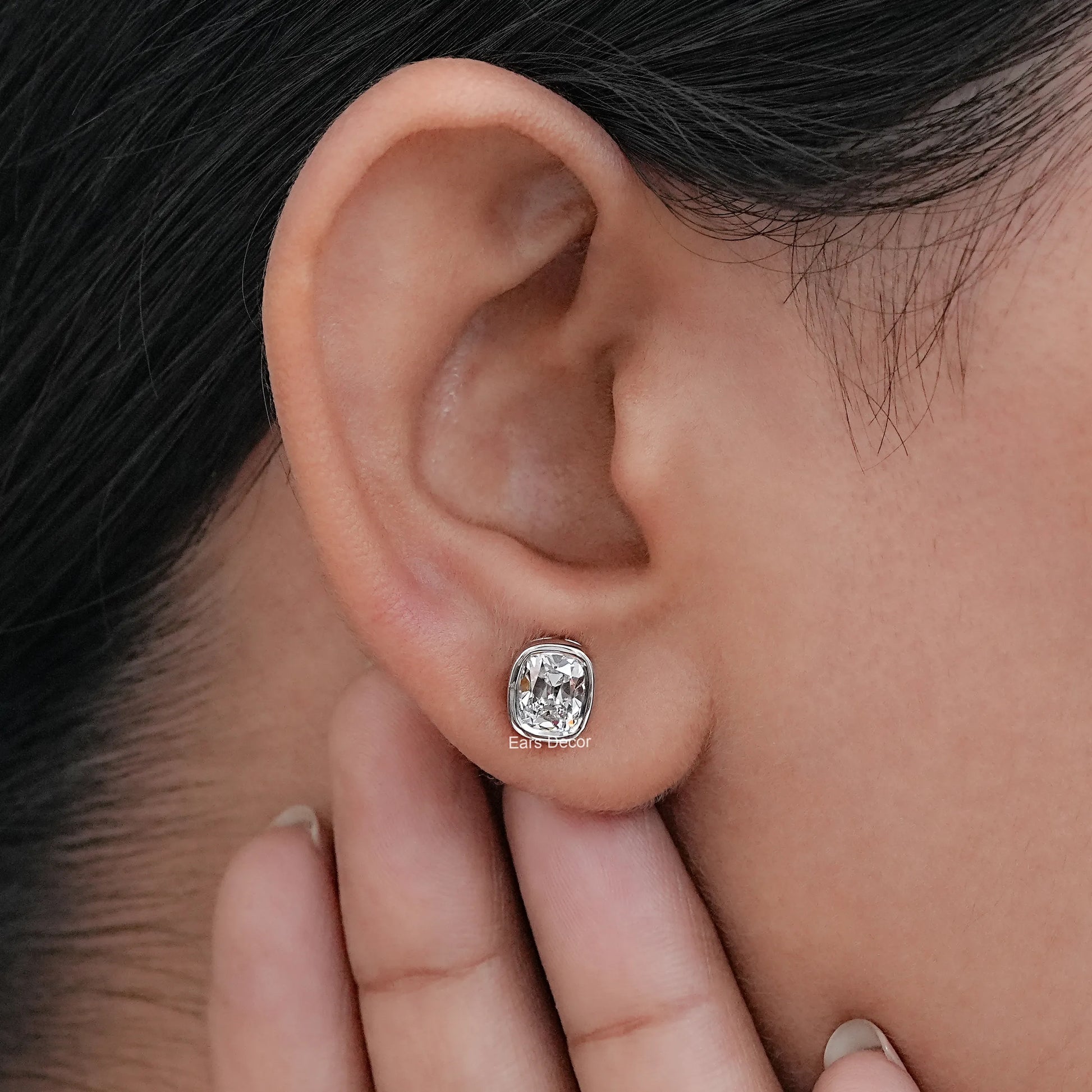 Old Mine Cushion Cut CVD Diamond Stud Earrings in 925 silver, showcased on an ear.