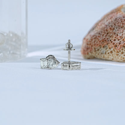 Minimalist toi et moi diamond earrings mixed shapes white gold front and side view white satin fabric glass coral rock background