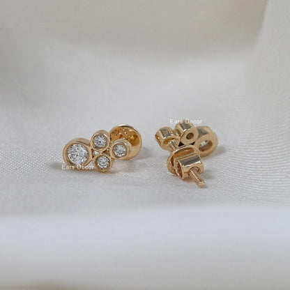 Minimalist diamond stud earrings front and back view on white fabric, screwback post in rose gold